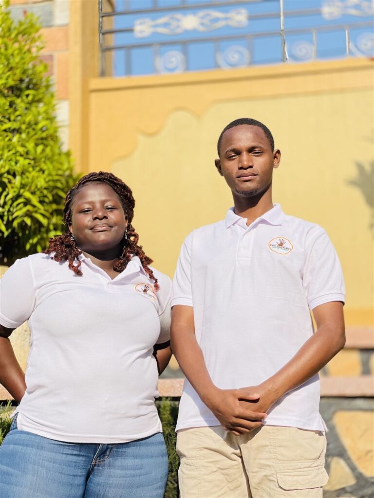 Douglas and Doreen of Two Servants Tours and Safaris in company polo shirts